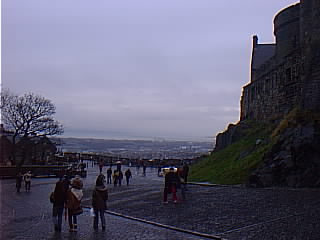 Edge of the castle with the city in the background.